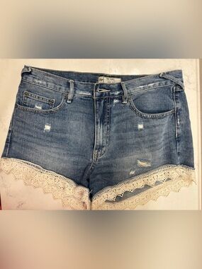 Free People Distressed Denim Shorts with Lace Trim